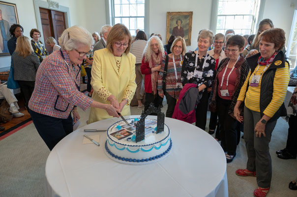 Former President Kathleen McCartney and Grécourt Society chair Pam Henrikson '62 cut the society's 25th anniversary cake at reunion in May 2019. Jim Gipe Photographer - Pivot Media